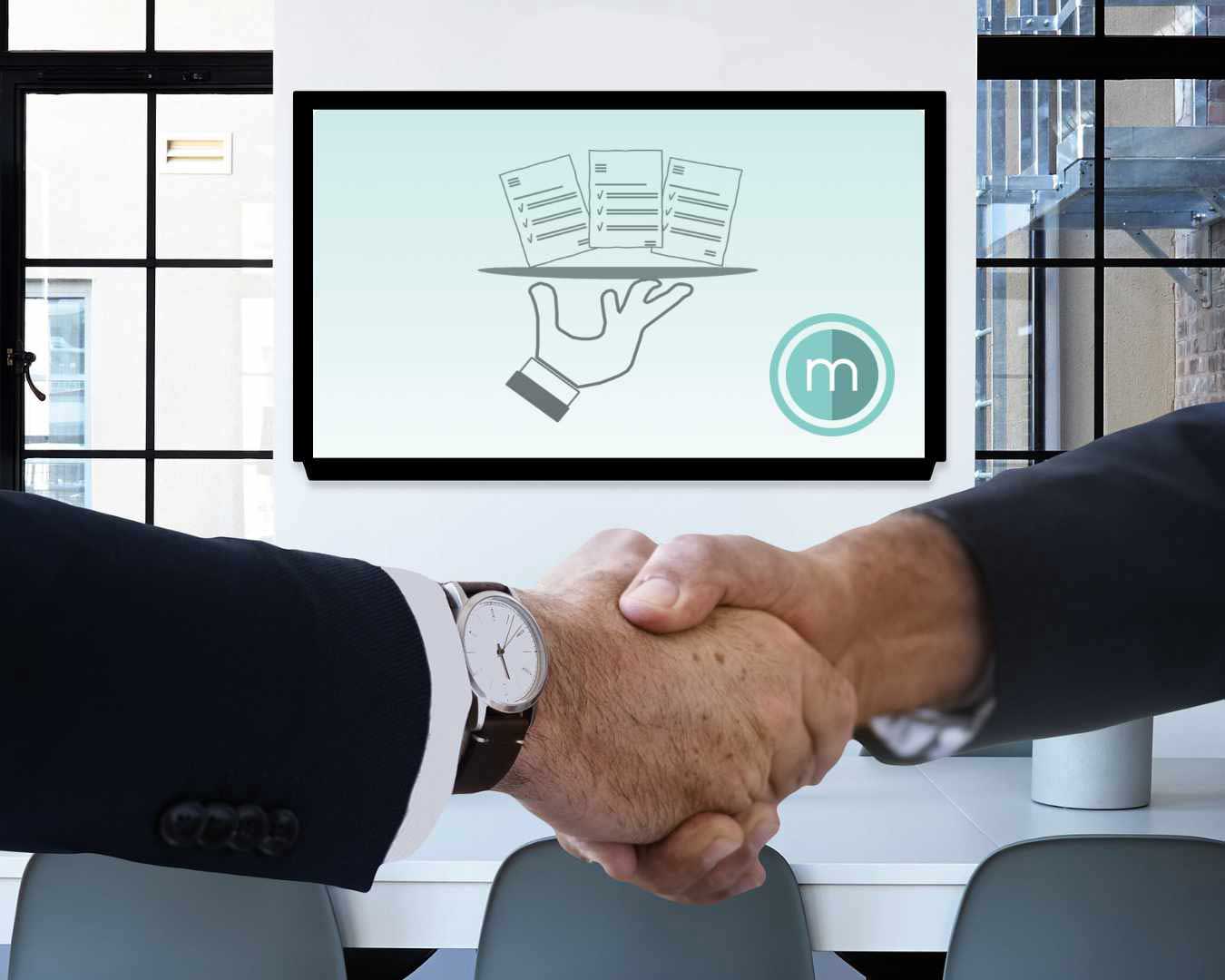 Håndtryk mellem to samarbejdspartner i MM